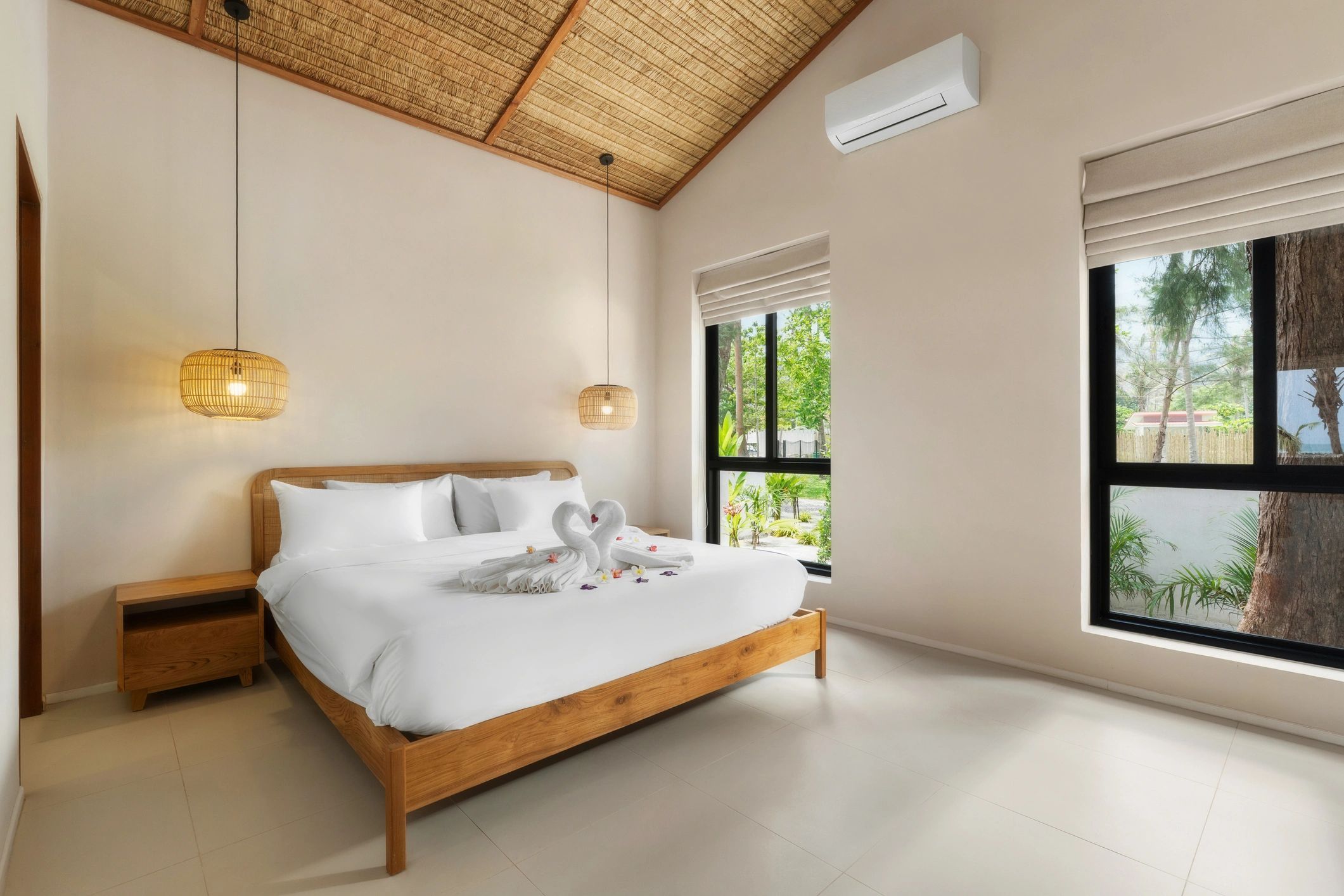 Luxury bedroom with king-size bed and bright interior