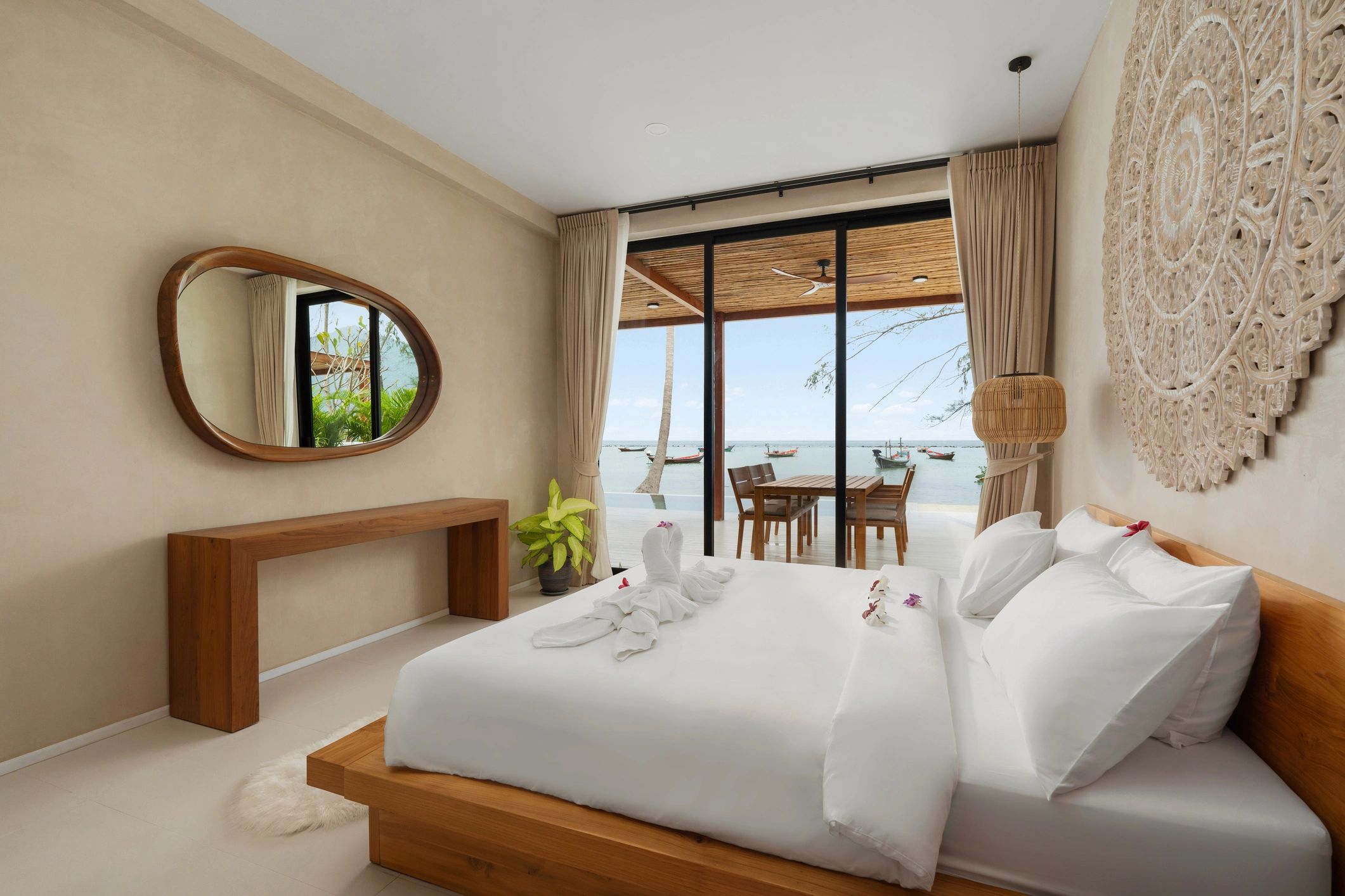 Modern guest bedroom with crisp linens and warm finishes